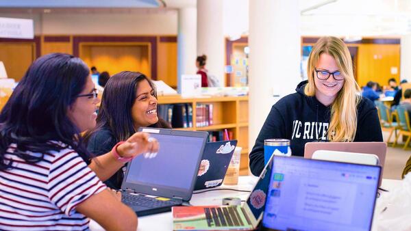 UCR Students study together in the library.