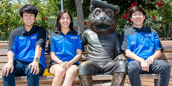 Campus Safety volunteers take a break at the Scotty statue.